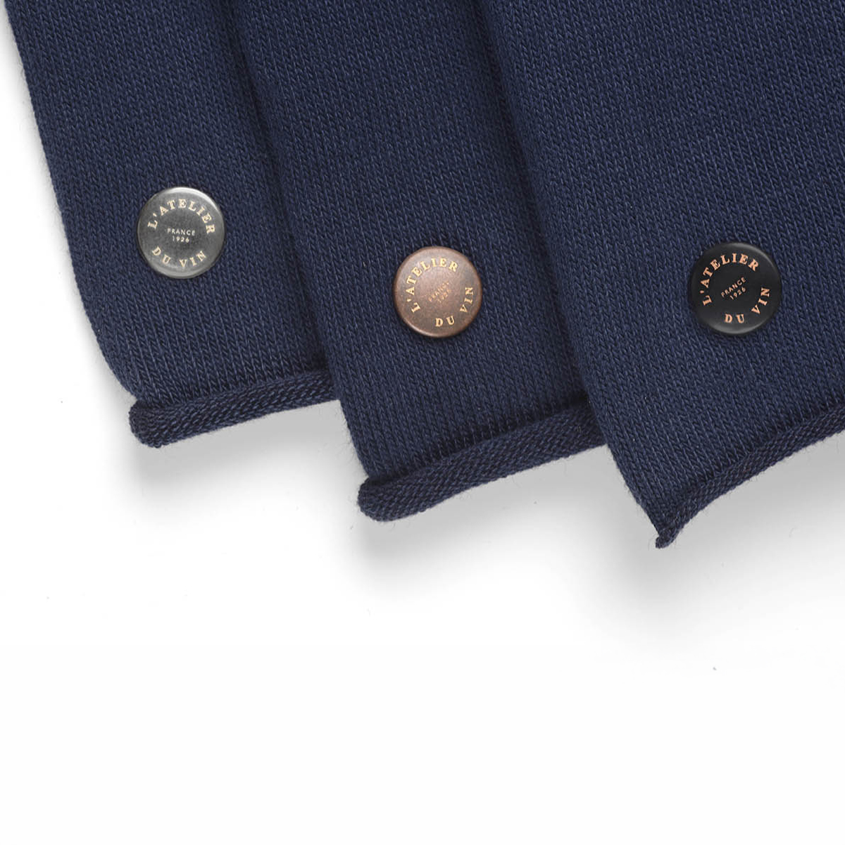 Colored rivets distinguish the three blind tasting bottle sleeves