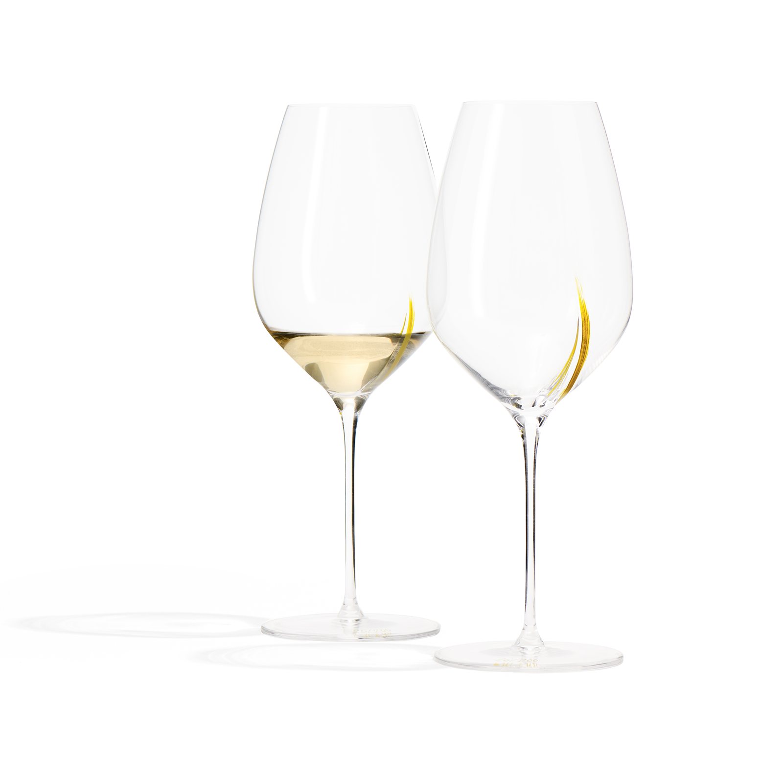 Two Exploreur 655 Centenary Edition wine glasses with white wine and hand-applied gold lines